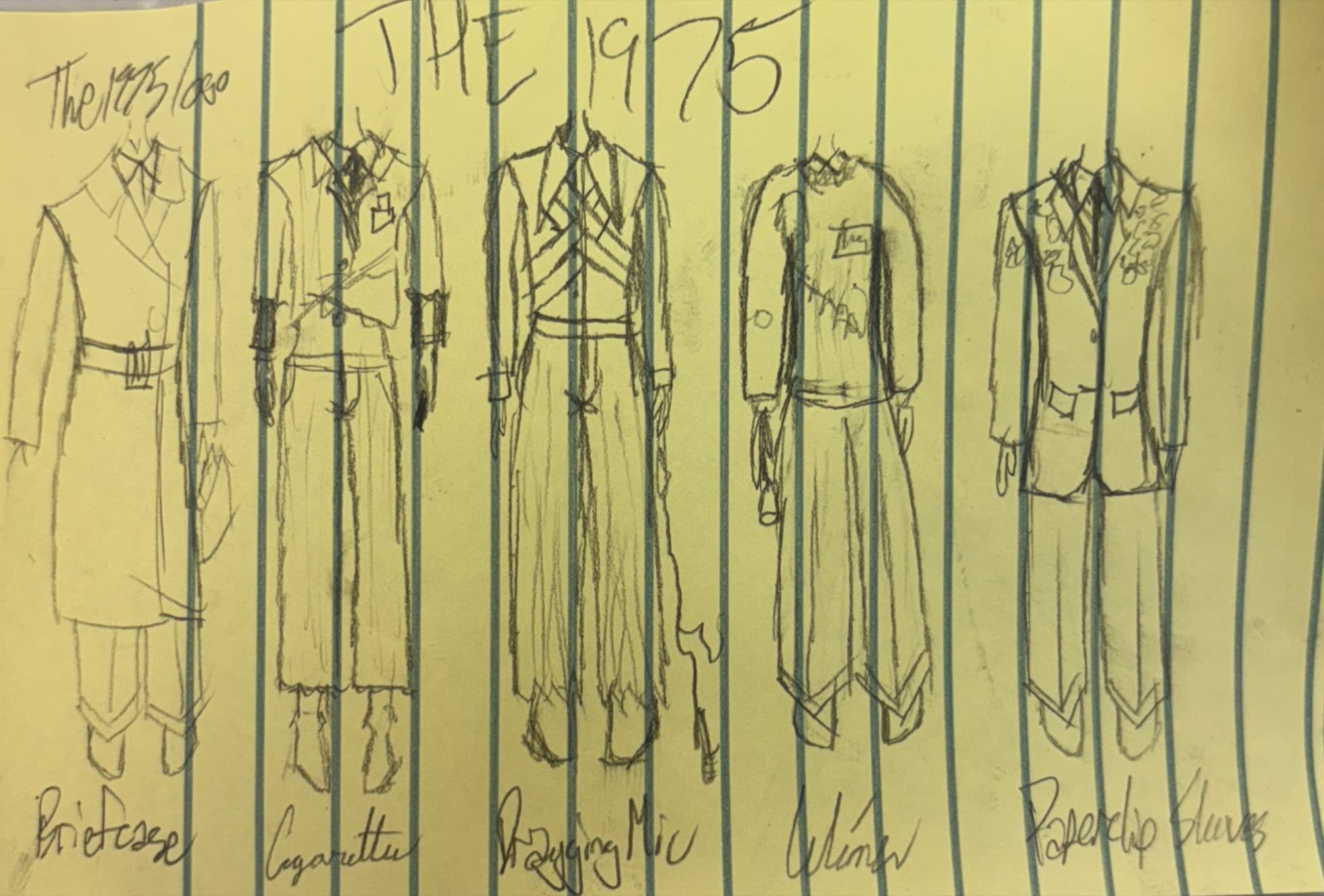 Original scrap-paper sketch on yellow legal pad titled The 1975, showing five named looks